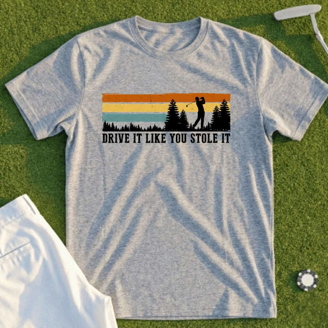 Drive It Like You Stole It funny golf t-shirt from Shanked Right, worn at the first tee before the round falls apart