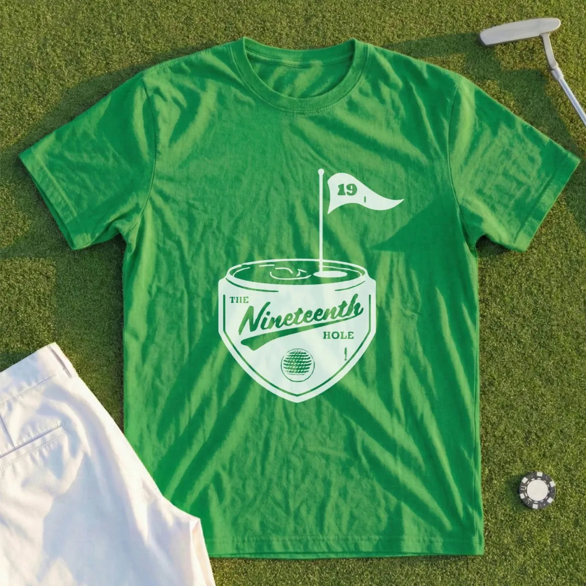 Green t-shirt with "The Nineteenth Hole" golf graphic.