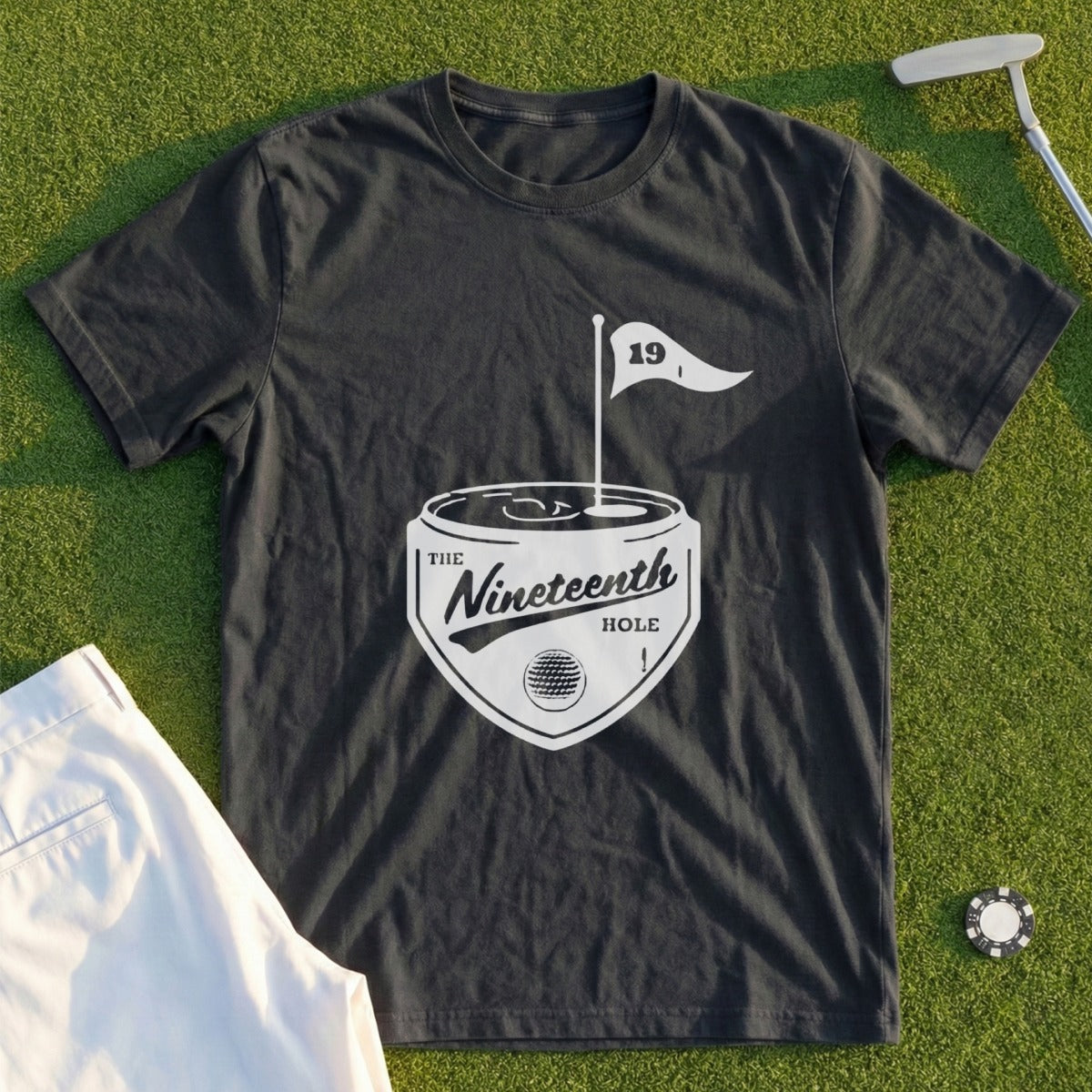 Dark t-shirt with "The Nineteenth Hole" logo and golf flag.