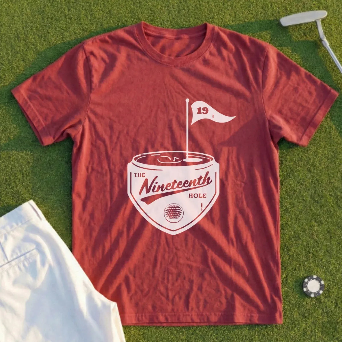 Red t-shirt with "The Nineteenth Hole" graphic, featuring a golf flag and club.