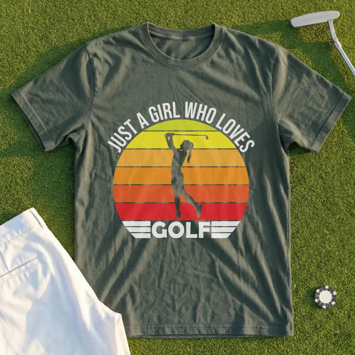 Green t-shirt with "Just a girl who loves golf" and sunset graphic.