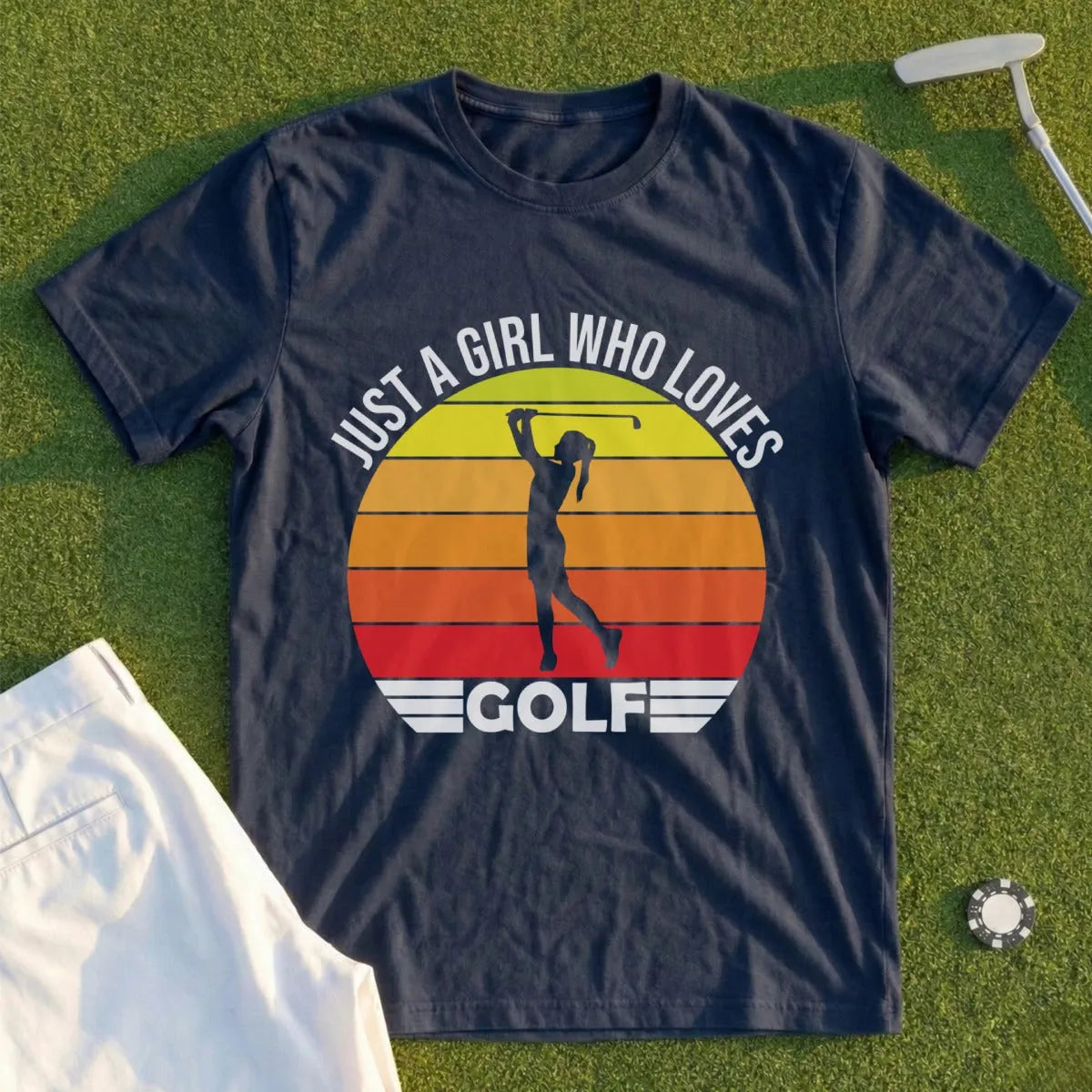 Dark blue t-shirt with graphic of a female golfer and "Just a girl who loves GOLF".