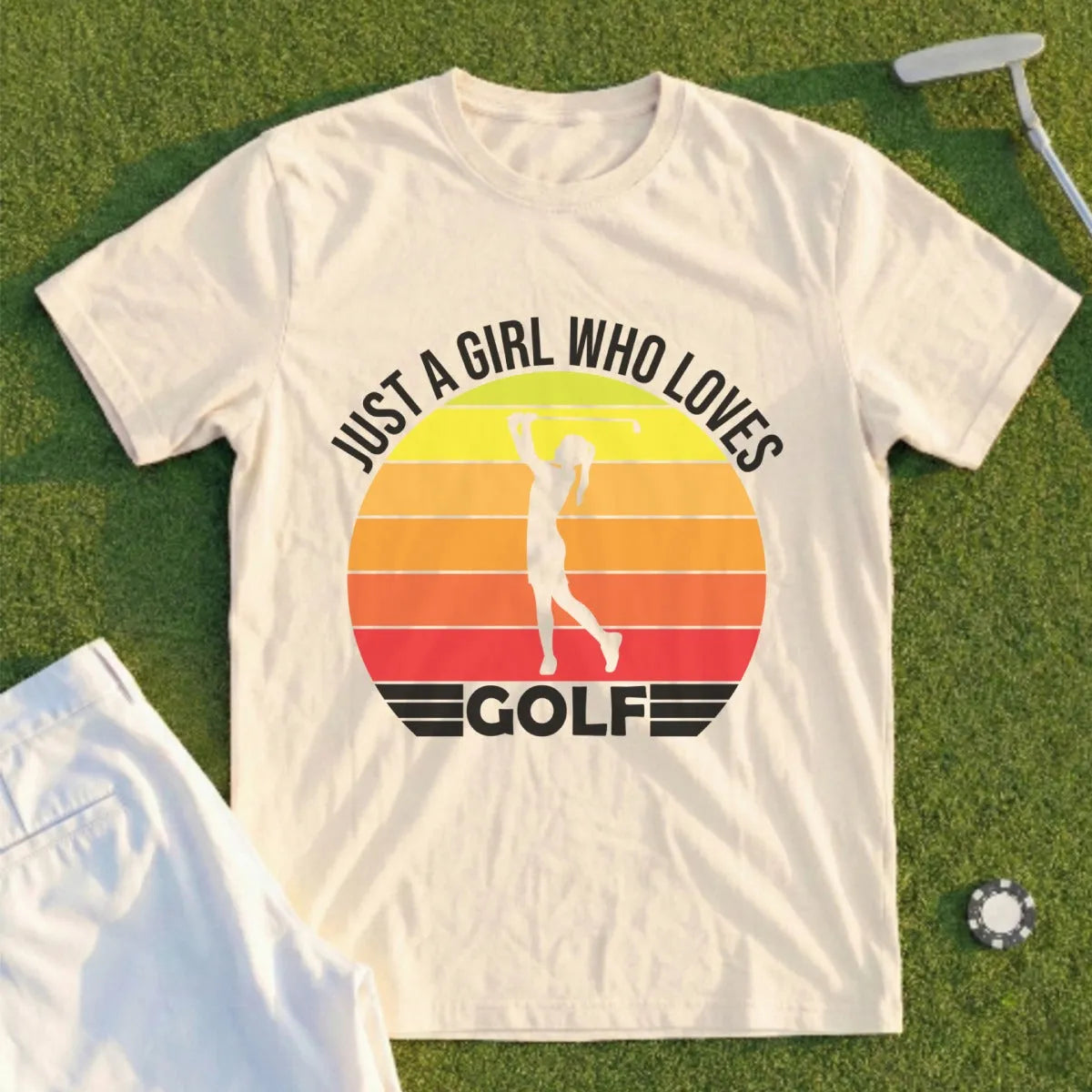 T-shirt with "Just a girl who loves golf" text and a sunset graphic.