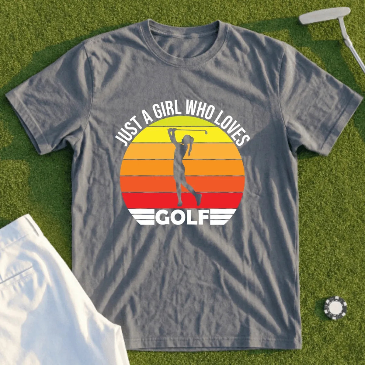 Gray t-shirt with "JUST A GIRL WHO LOVES GOLF" and sunset graphic.
