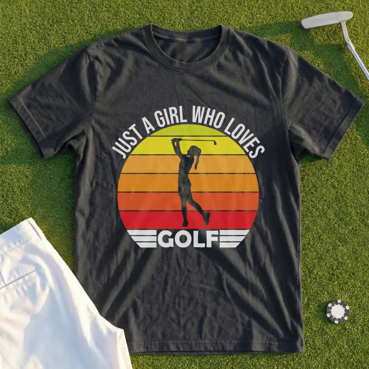 Dark t-shirt with graphic of a woman golfing and text "Just a girl who loves golf."