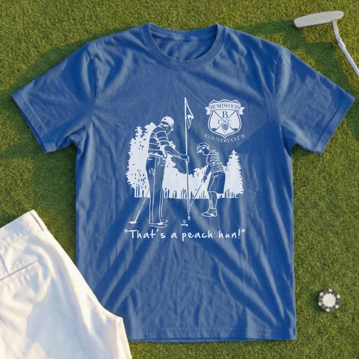 Blue t-shirt with "That's a peach hon!" and country club logo.