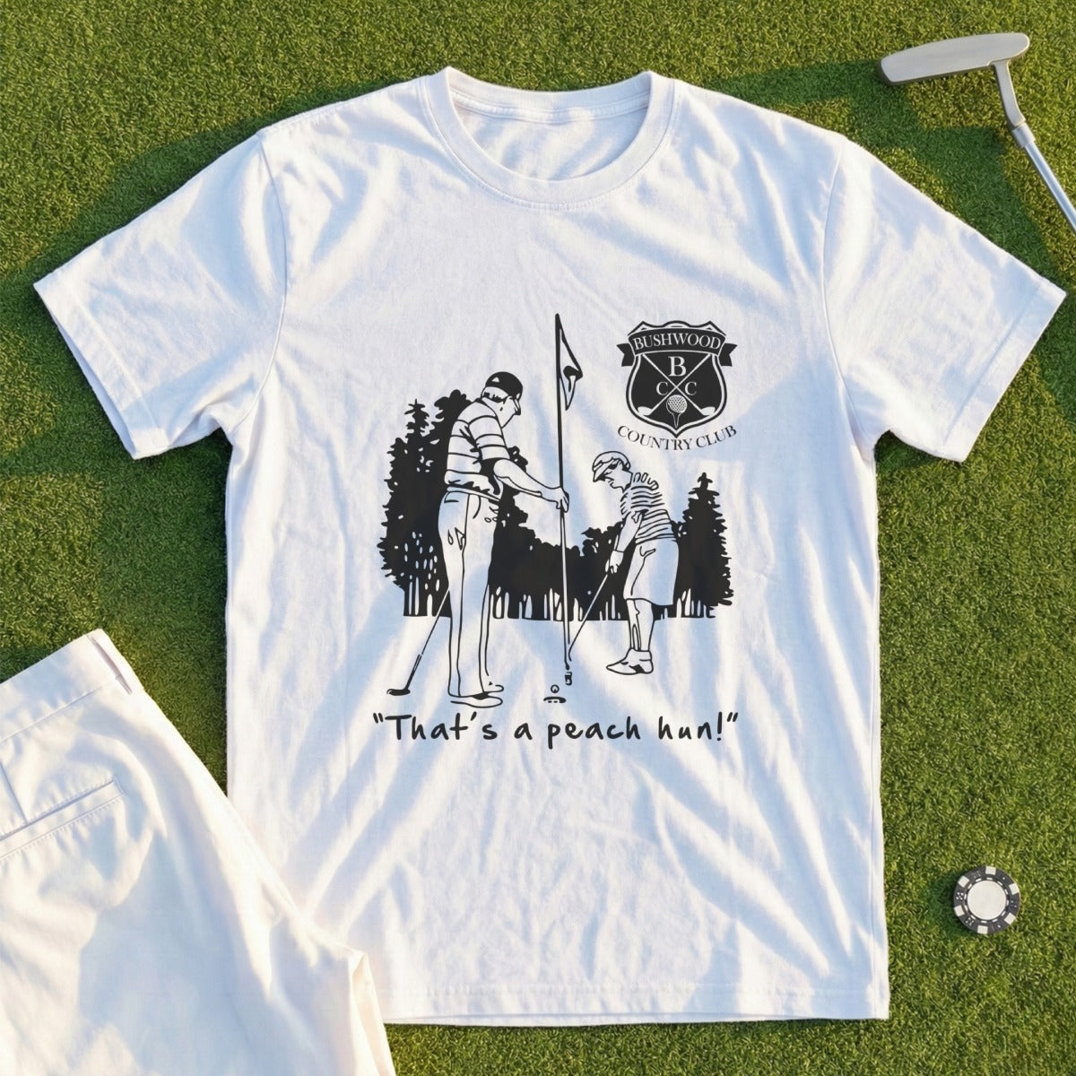 White t-shirt with "Bushwood Country Club" logo and cartoon golf illustration.