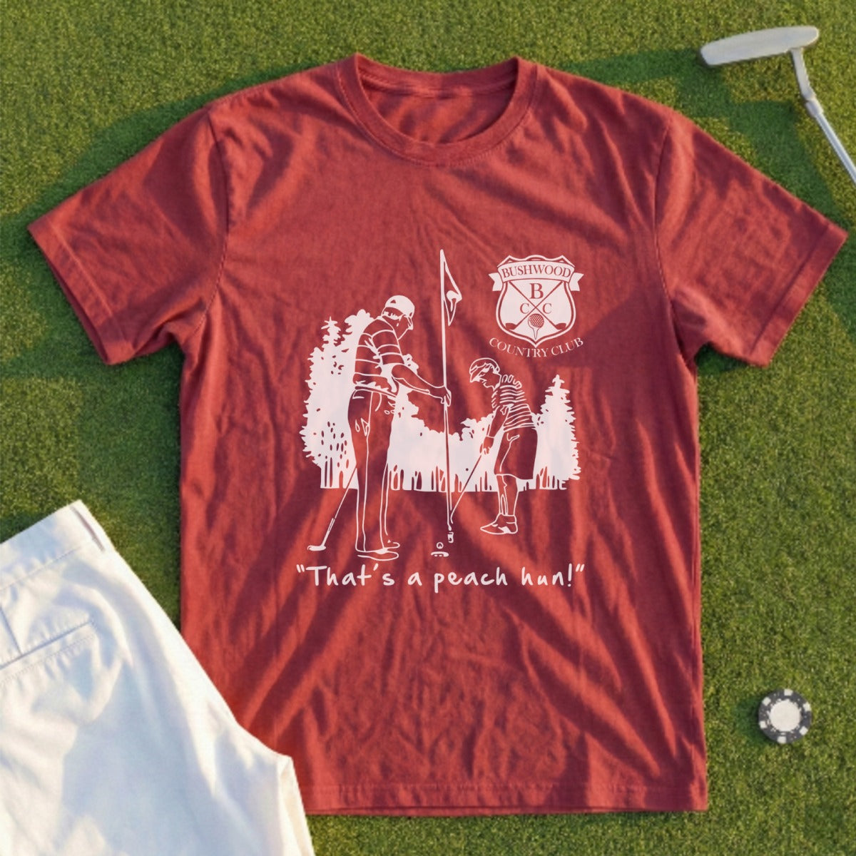 Burgundy t-shirt with "That's a peach hon!" and golf illustrations.