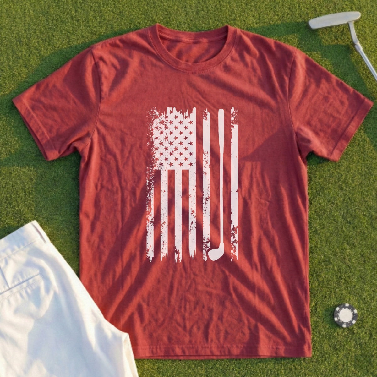 Red t-shirt with distressed American flag golf club graphic and golf accessories.