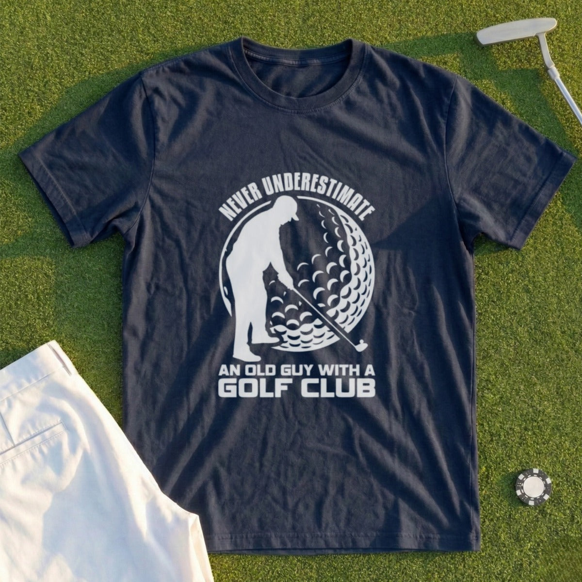 Dark blue t-shirt with "Never Underestimate An Old Guy With A Golf Club" slogan.