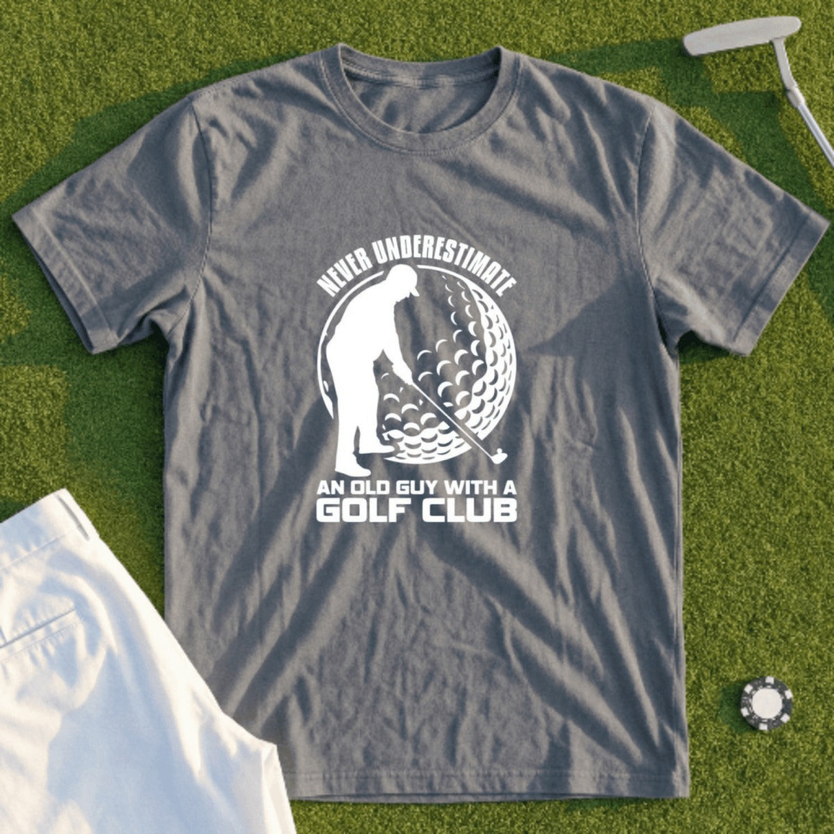 Gray t-shirt with "Never Underestimate An Old Guy With A Golf Club" text and graphic.