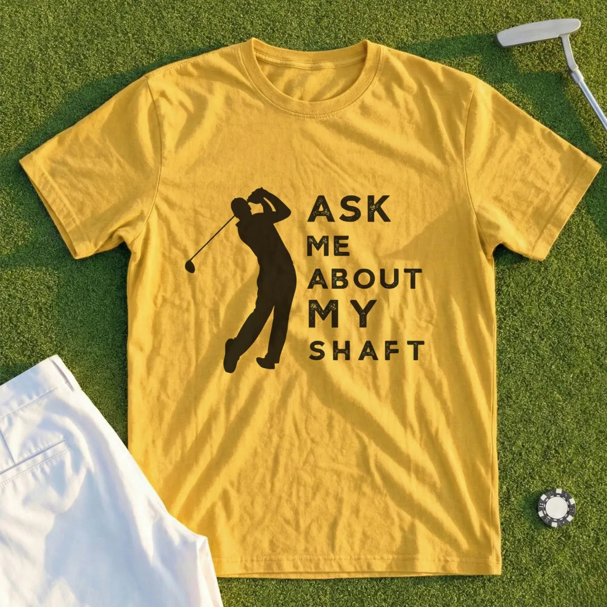 Yellow t-shirt with black silhouette of golfer and text "Ask Me About My Shaft".