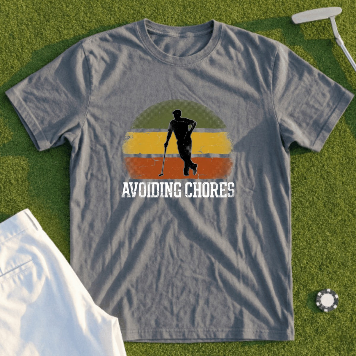 T-shirt with golfer silhouette and "AVOIDING CHORES" text.