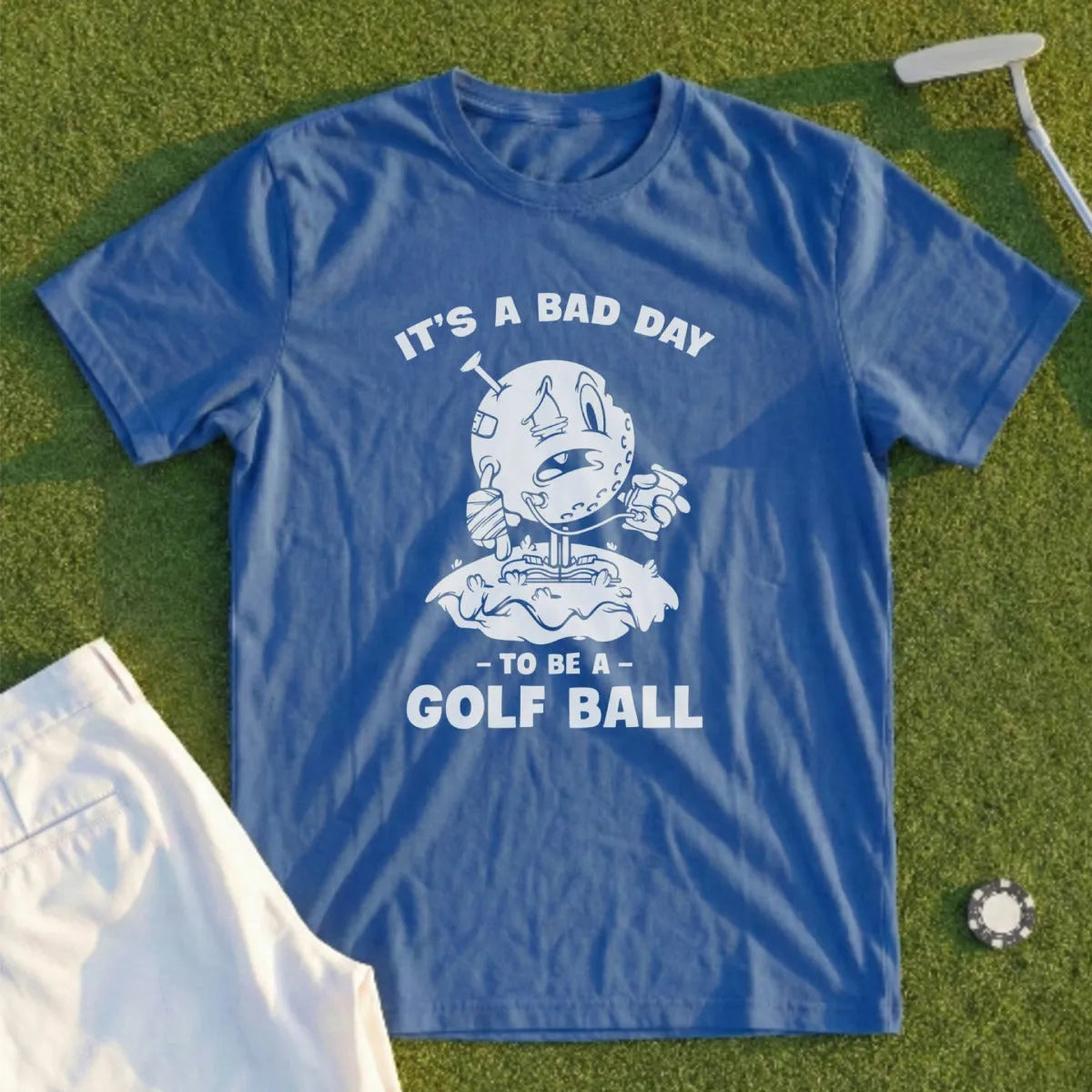Blue t-shirt with "IT'S A BAD DAY TO BE A GOLF BALL" graphic.