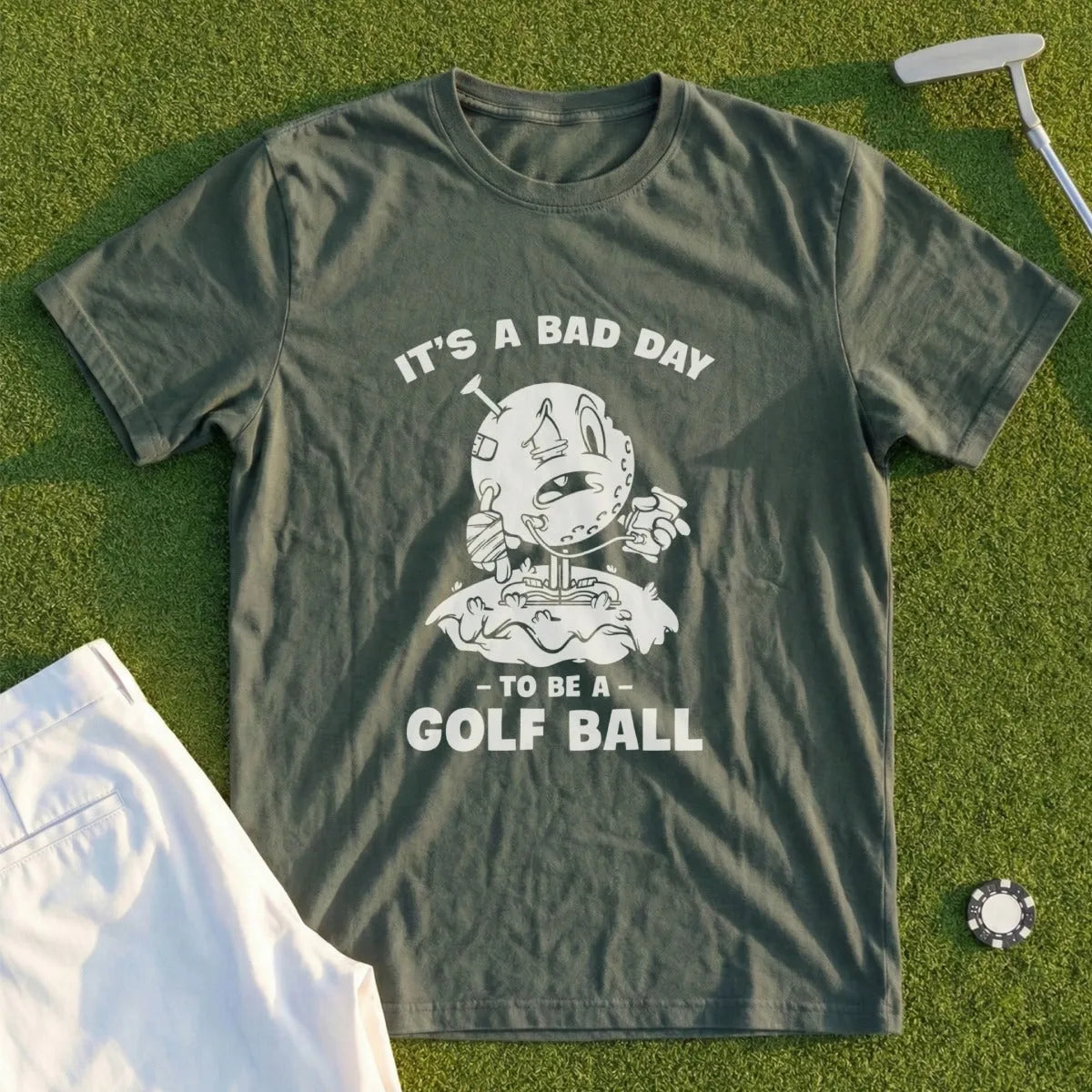 Green t-shirt with "It's a bad day to be a golf ball" graphic.