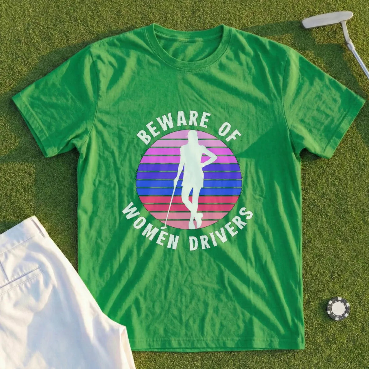 Green t-shirt with "Beware of Women Drivers" text and golfer graphic.