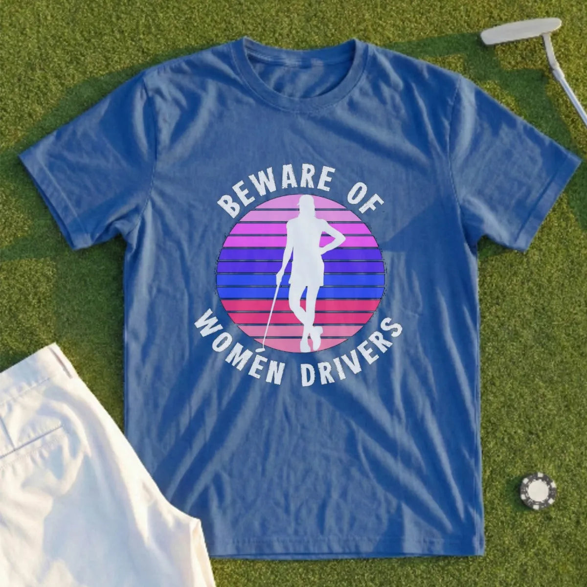 Blue t-shirt with "Beware of Women Drivers" text and a woman golfer silhouette.