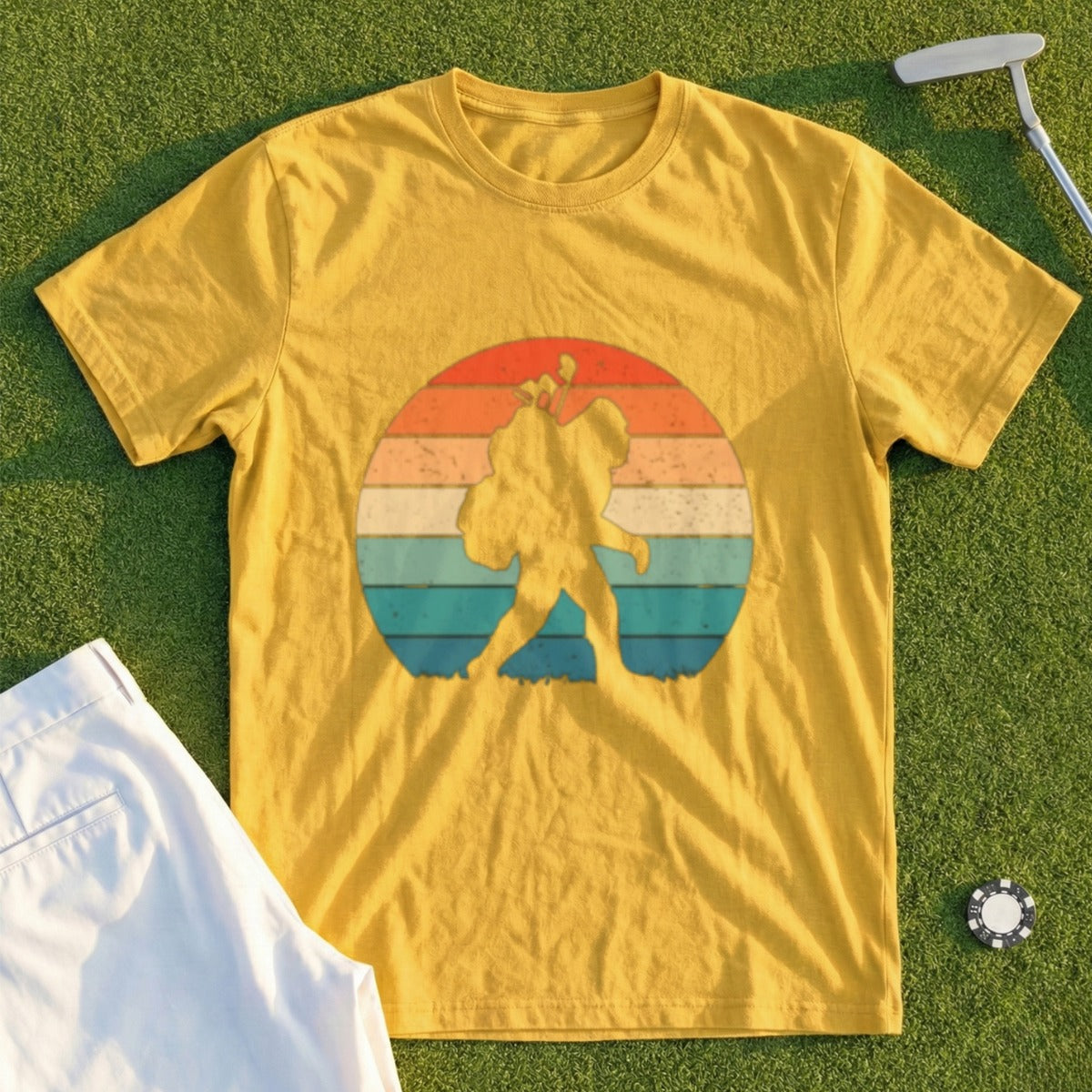Yellow t-shirt with a Bigfoot silhouette in a retro sunset circle.