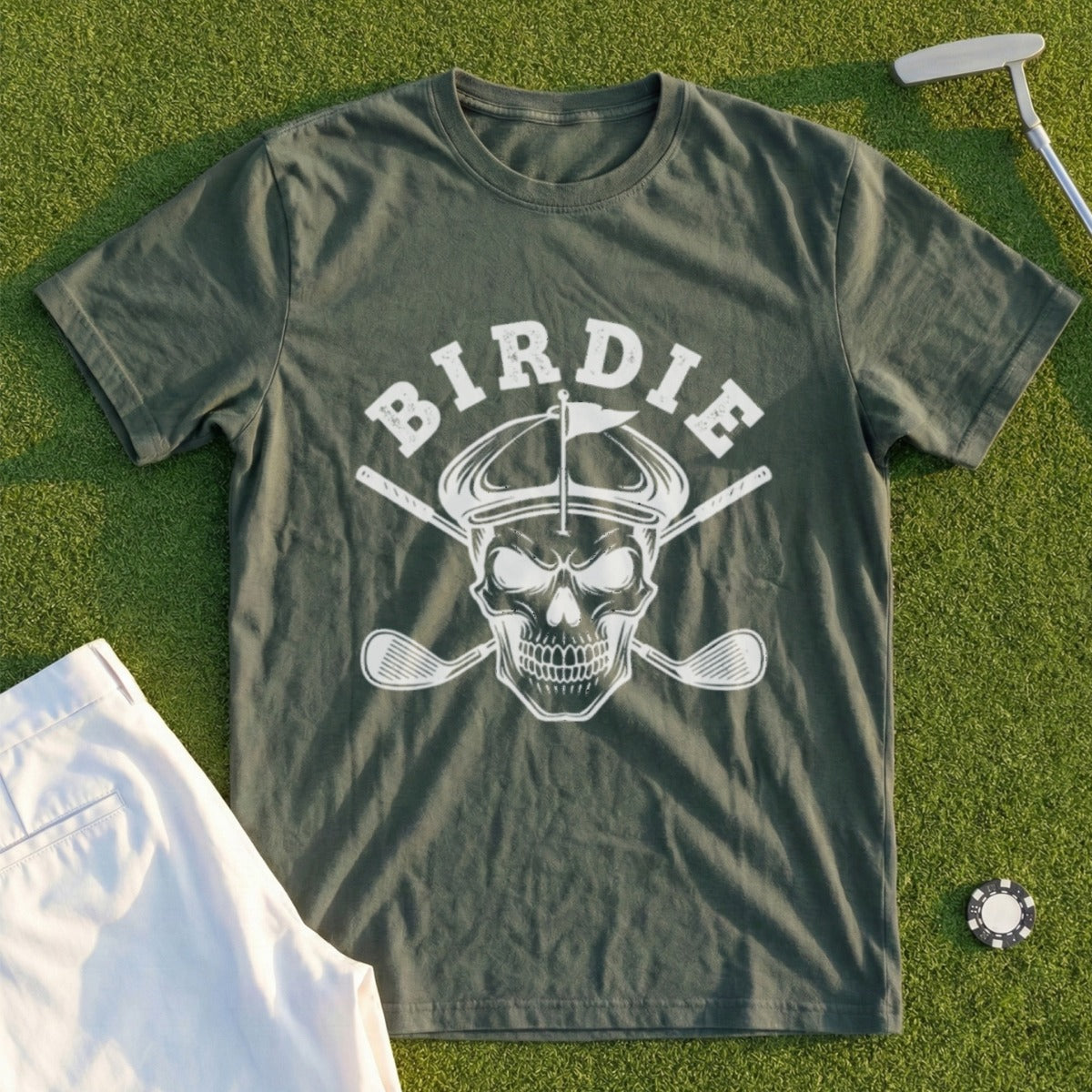 Green t-shirt with skull wearing a golf hat and crossed golf clubs graphic.