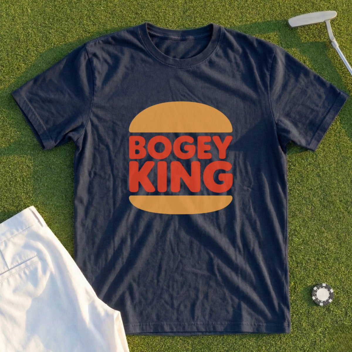 Navy t-shirt with "Bogey King" logo on a golf course.