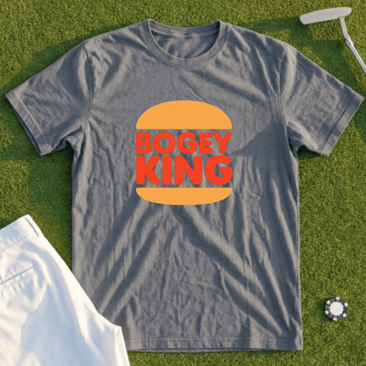 Gray t-shirt with orange and red "Bogey King" burger logo, on grass.