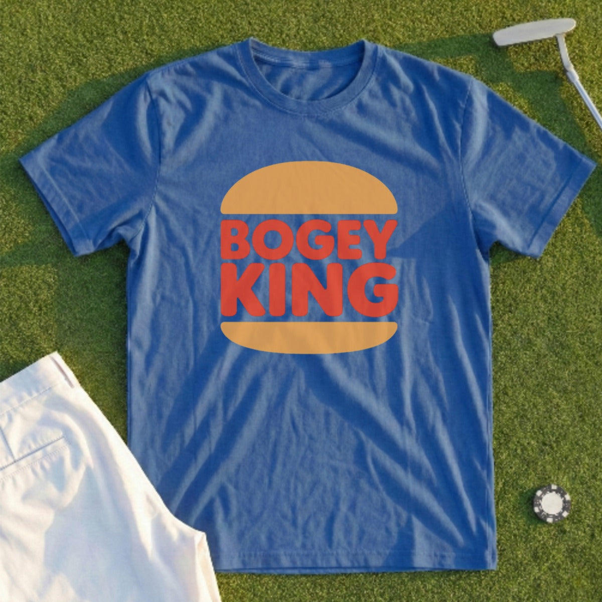 Blue t-shirt with "Bogey King" logo on a golf course.