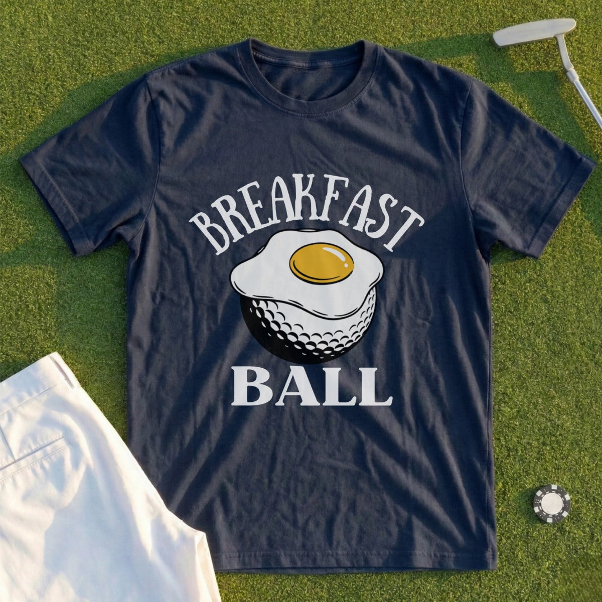 Navy t-shirt with "Breakfast Ball" text and fried egg on a golf ball graphic.