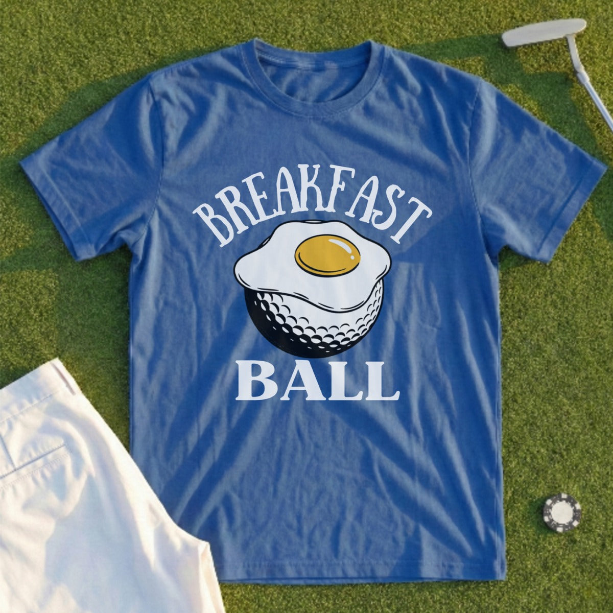 Blue t-shirt with "BREAKFAST BALL" text and fried egg on a golf ball.