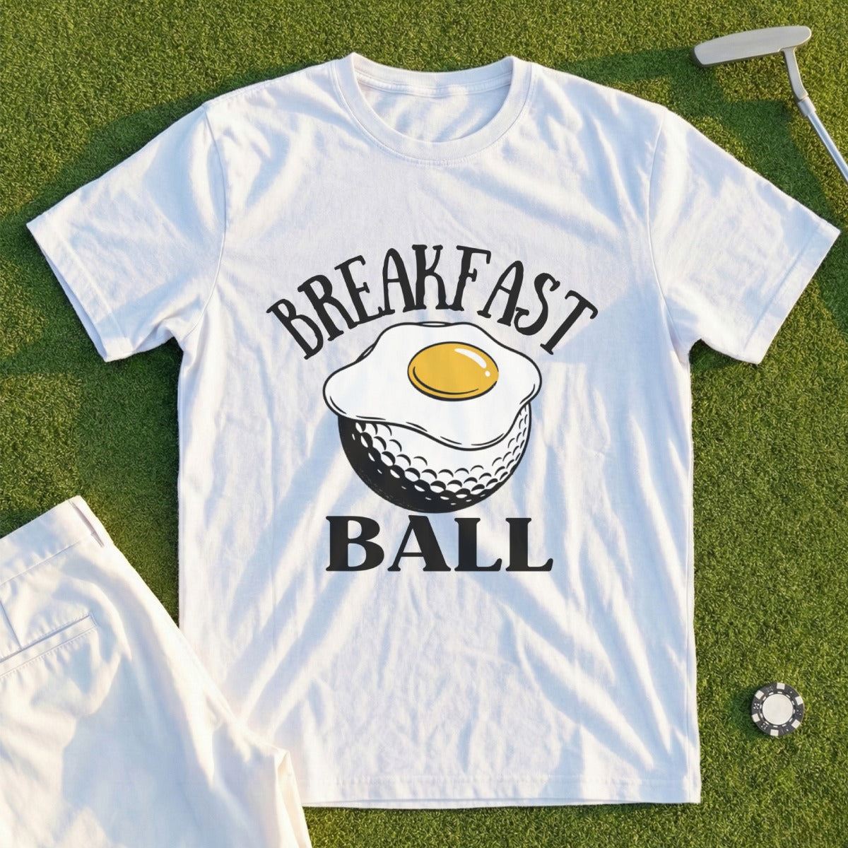 White t-shirt with "Breakfast Ball" text and fried egg on a golf ball.
