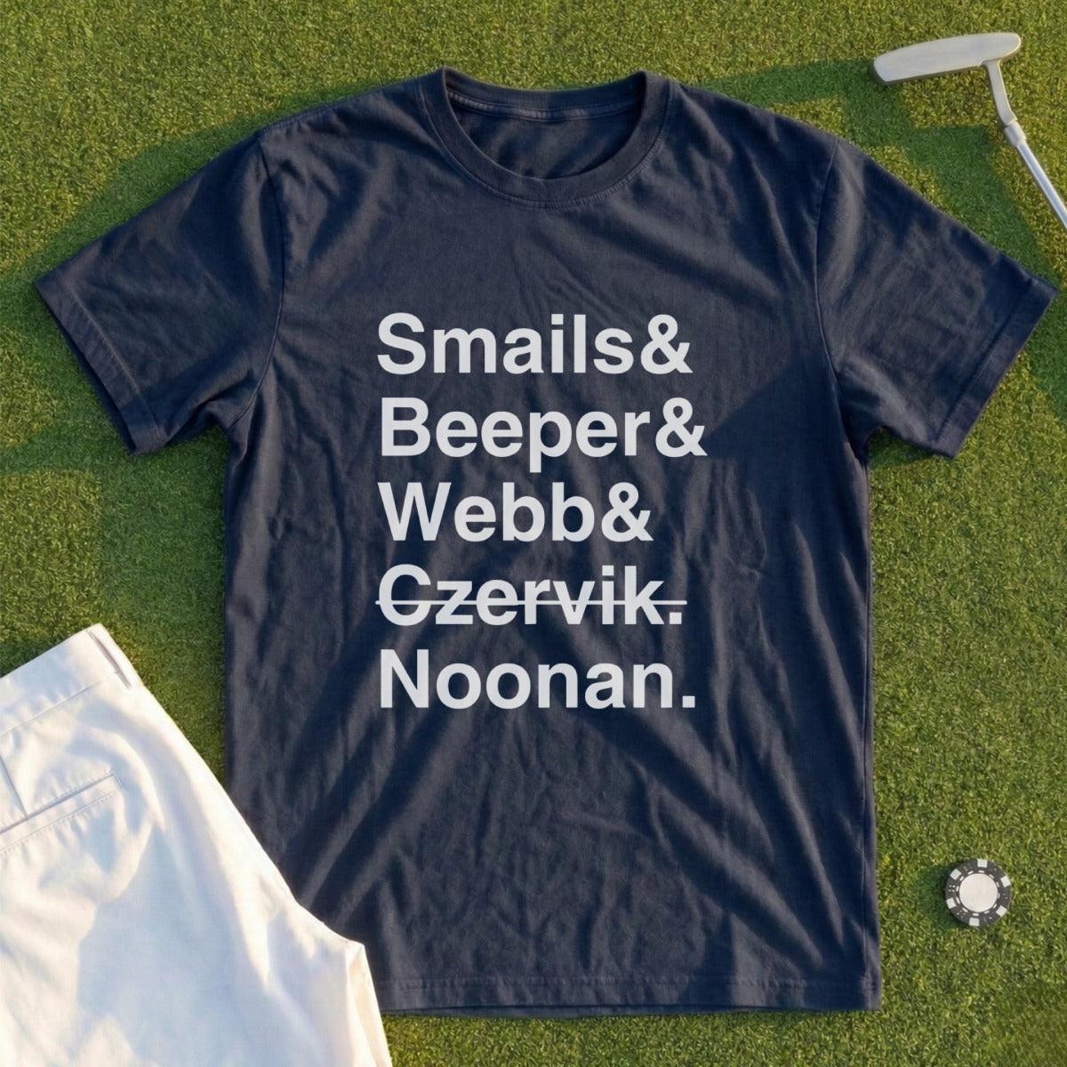 Navy t-shirt with "Smails & Beeber & Czervik. Noonan." text, on a golf course.