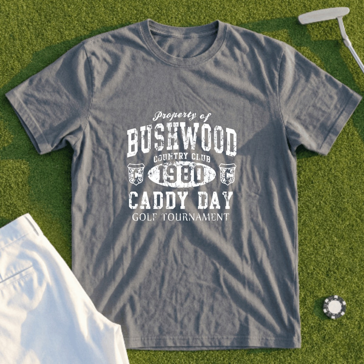 Grey t-shirt with "Bushwood Country Club 1980 Caddy Day Golf Tournament" text.