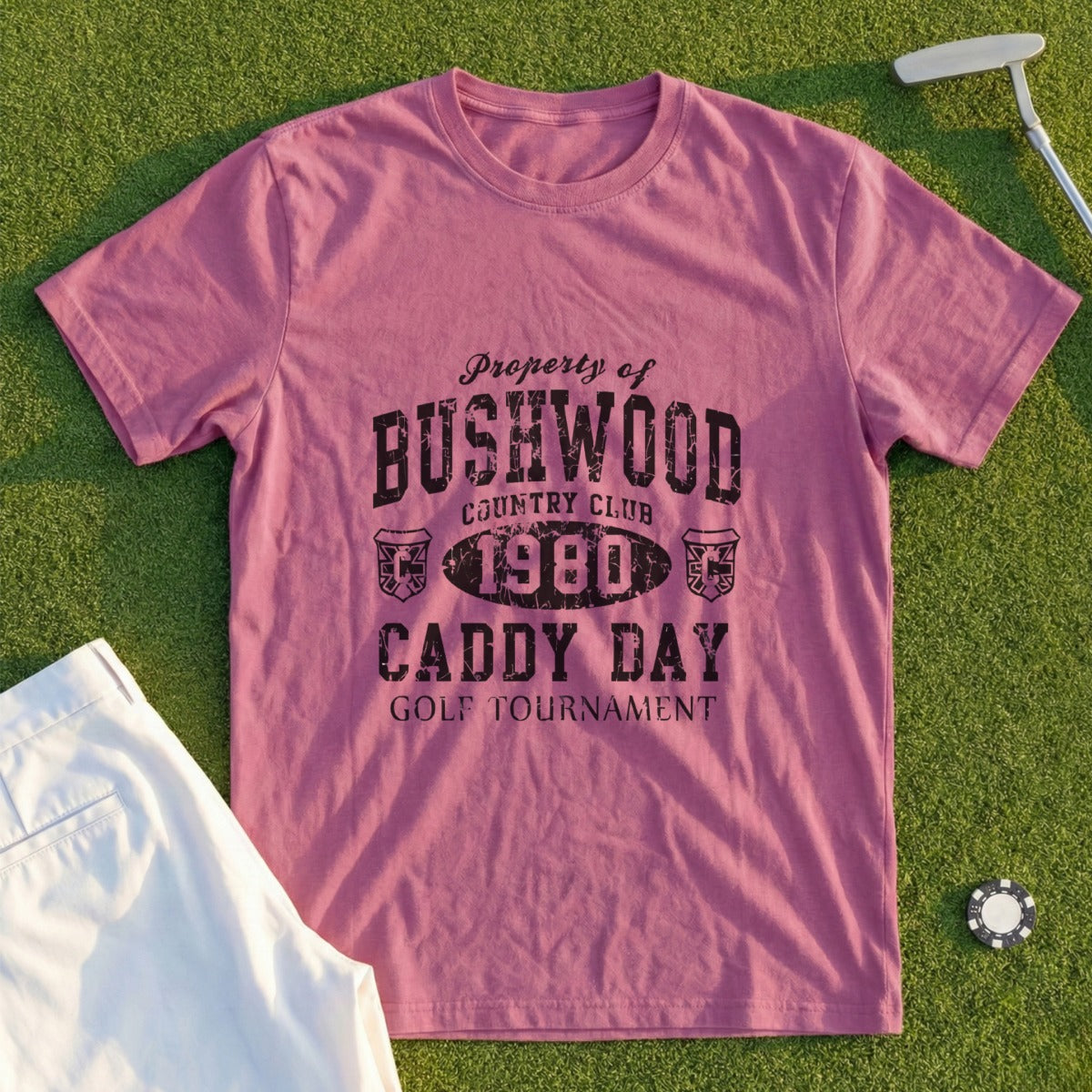 Rose t-shirt with "Property of Bushwood Country Club 1980 Caddy Day Golf Tournament" graphic.