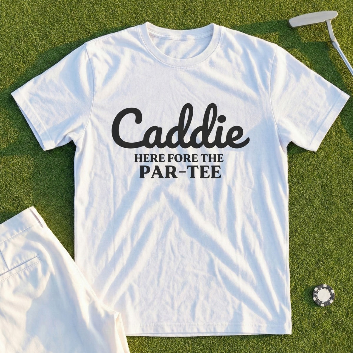 White t-shirt with black text that reads "Caddie HERE fore the PAR-TEE".
