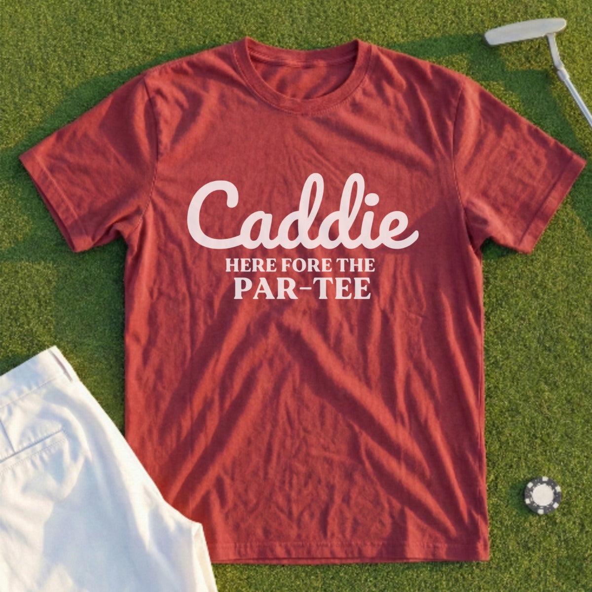 Burgundy t-shirt with "Caddie HERE fore the PAR-TEE" in white text.