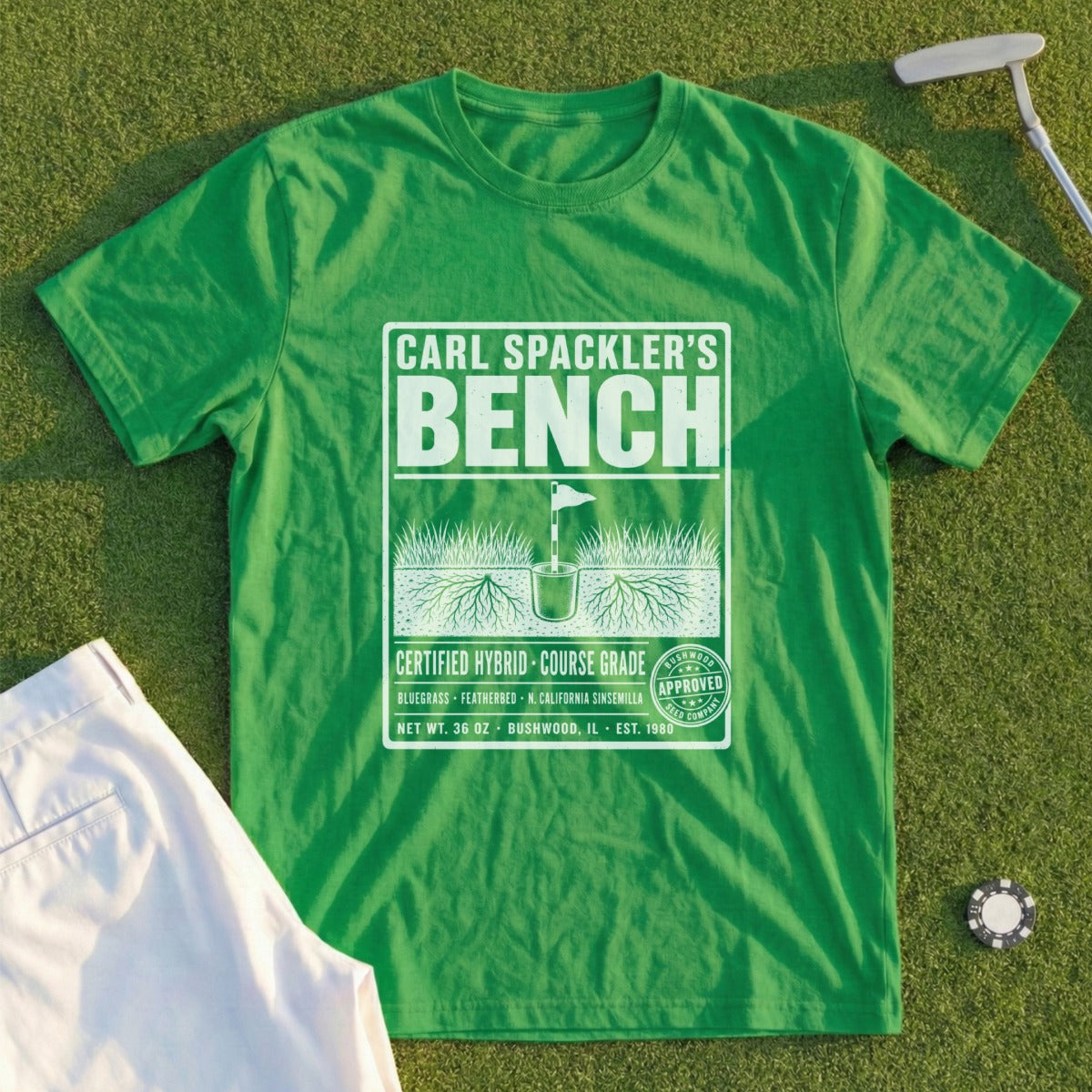 Green t-shirt with "Carl Spackler's Bench" and golf-themed graphics.