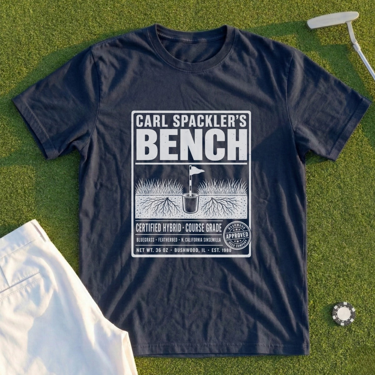Navy t-shirt with "Carl Spackler's Bench" text and golf-themed design.