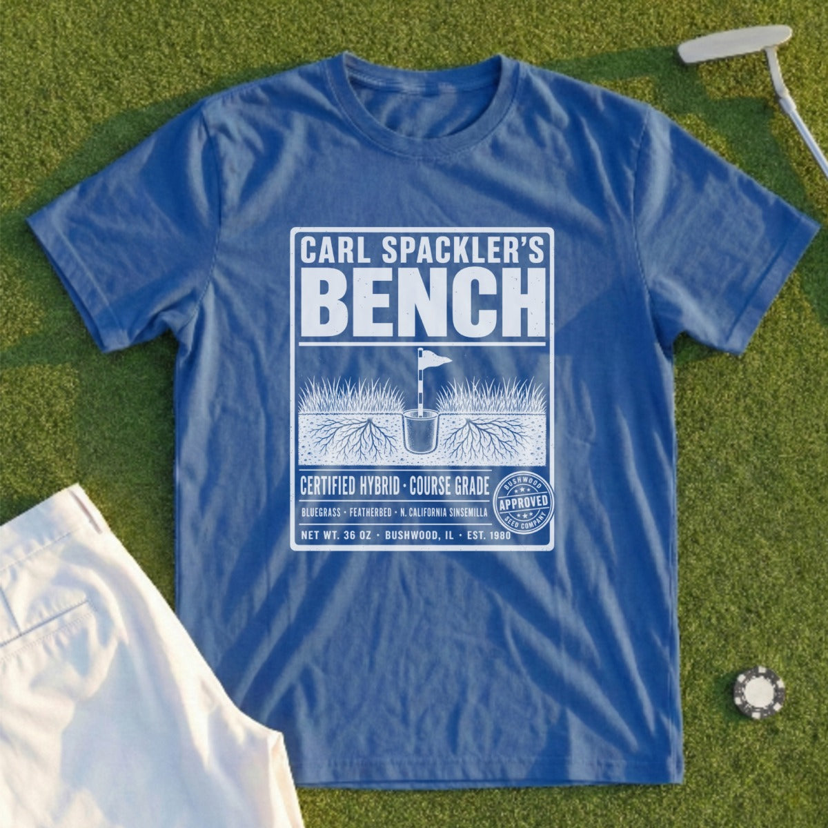Blue t-shirt with "Carl Spackler's Bench" and golf course seed packet design.
