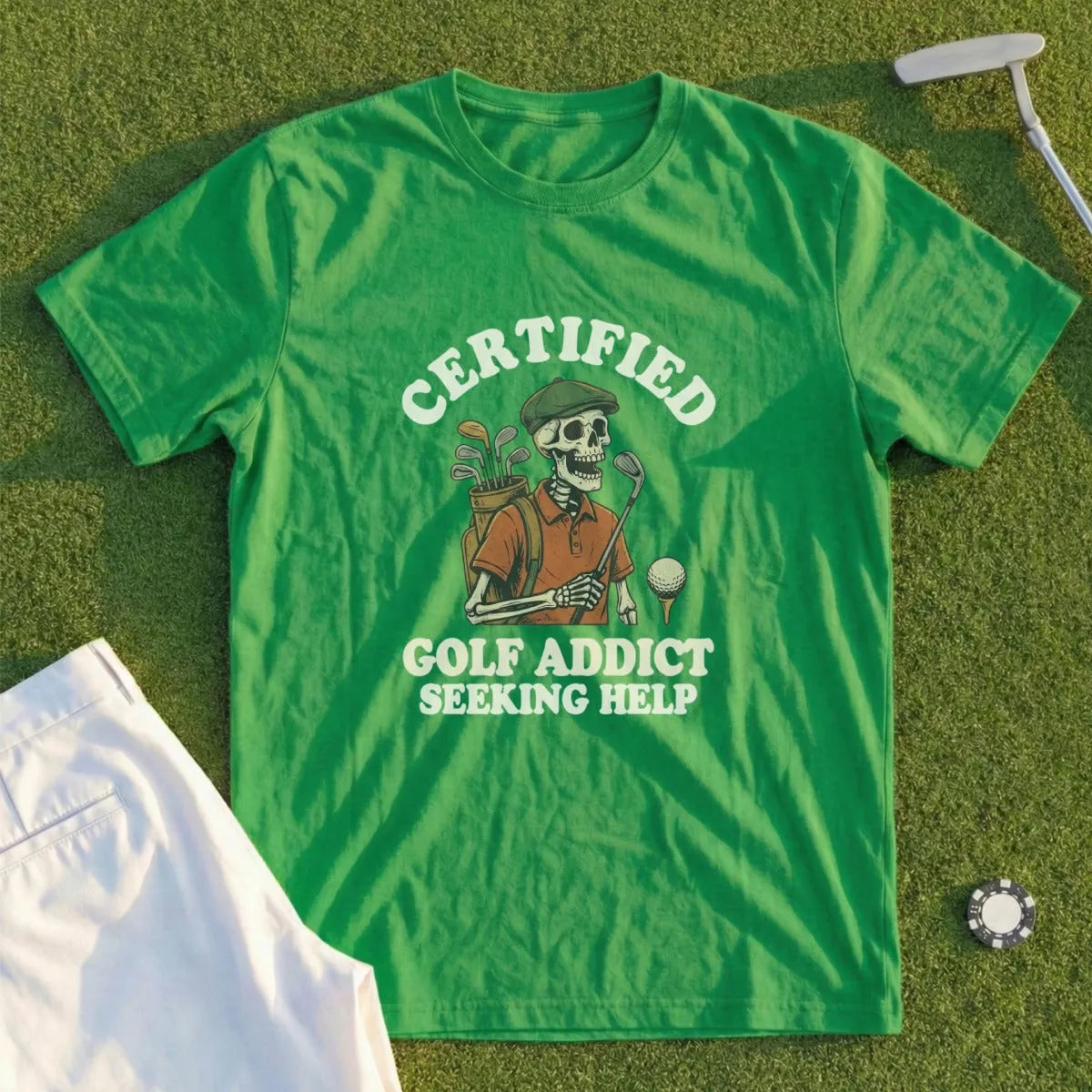 Green t-shirt with skeleton golfer graphic and "Certified Golf Addict Seeking Help" text.