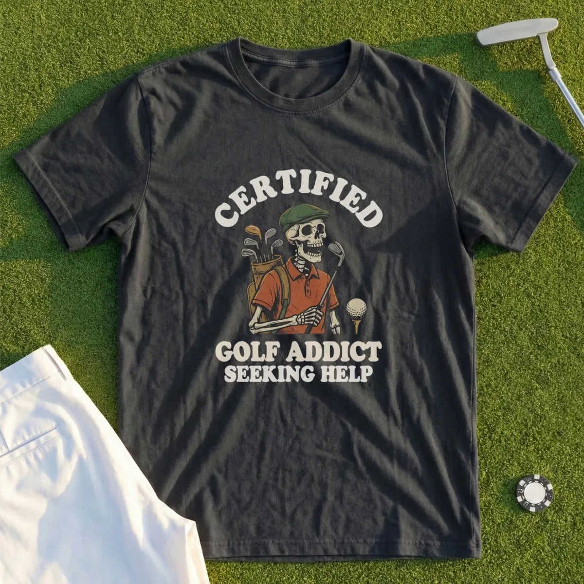 Dark t-shirt with skeleton golfer and text "CERTIFIED GOLF ADDICT SEEKING HELP".