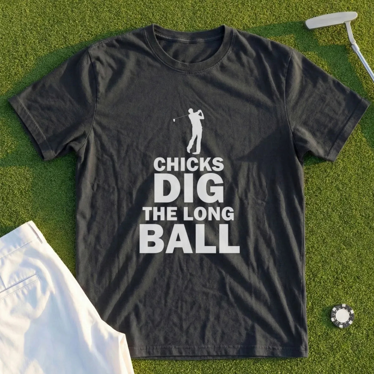 Dark t-shirt with white text and a golfer graphic: "CHICKS DIG THE LONG BALL."