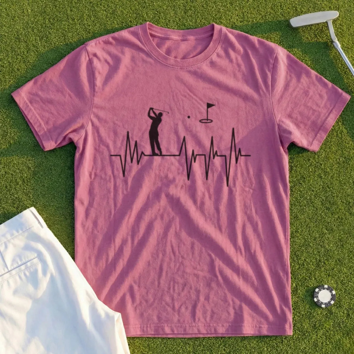 Pink t-shirt with a golf heartbeat graphic and a golf ball.