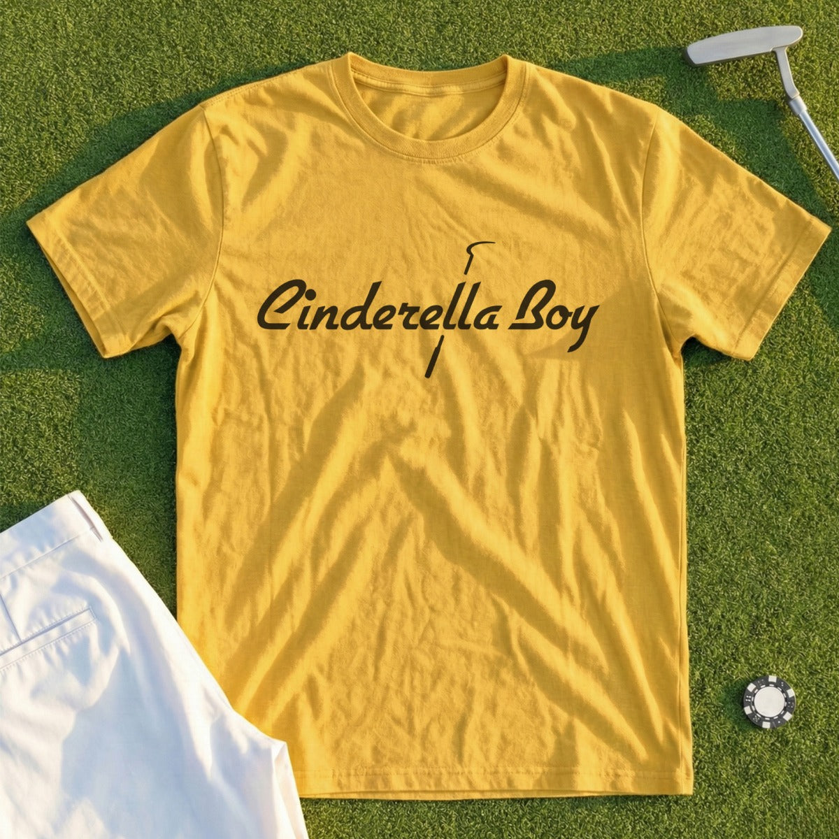 Yellow t-shirt with "Cinderella Boy" text and a golf club.