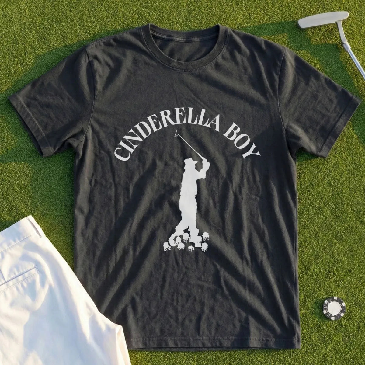 Dark t-shirt with "CINDERELLA BOY" and white golfer silhouette over small skulls.