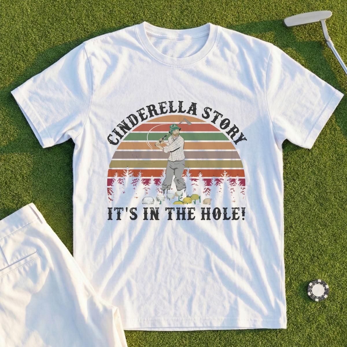 T-shirt with "Cinderella Story It's in the Hole!" text and golfer illustration.