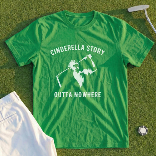 Green t-shirt with "Cinderella Story Outta Nowhere" text and a golfer graphic.