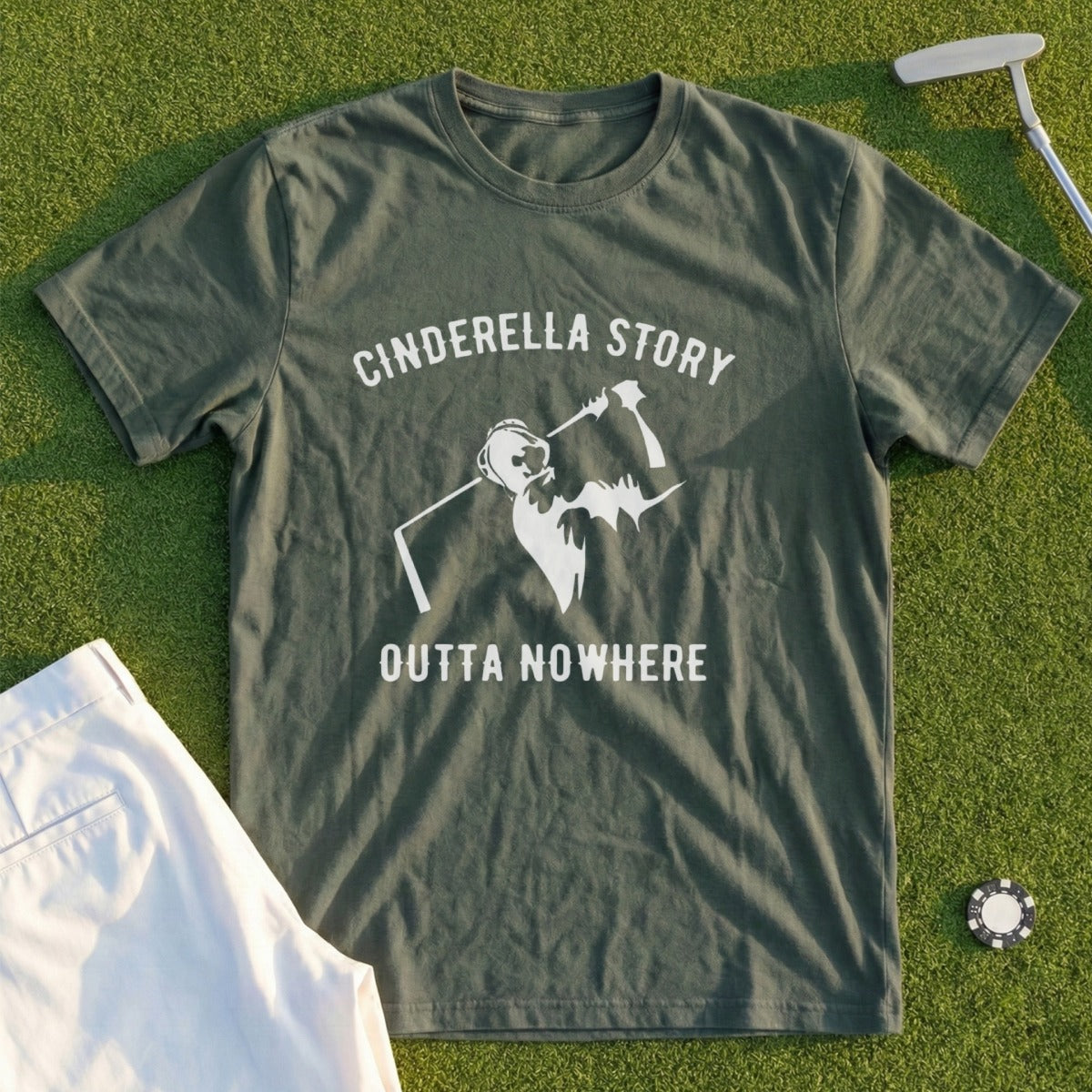 Green t-shirt with "Cinderella Story Outta Nowhere" text and golf graphic.