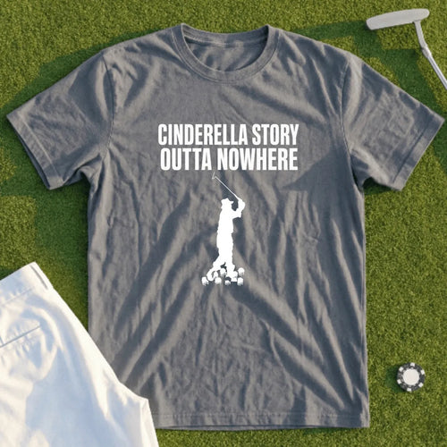 Grey t-shirt with white graphic of golfer and text "CINDERELLA STORY OUTTA NOWHERE".