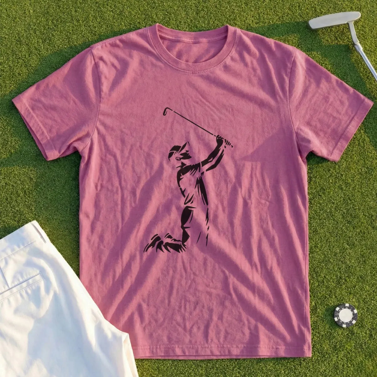 Pink t-shirt with a golfer silhouette and white golf pants.