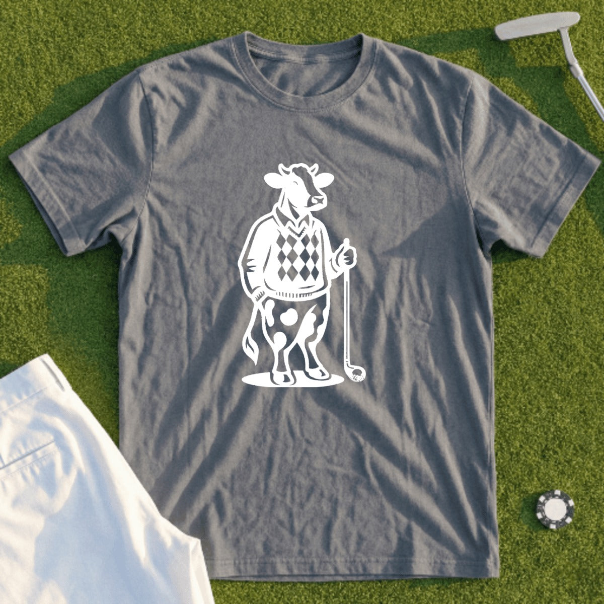 Gray t-shirt with white graphic of a cow wearing a sweater and holding a golf club.