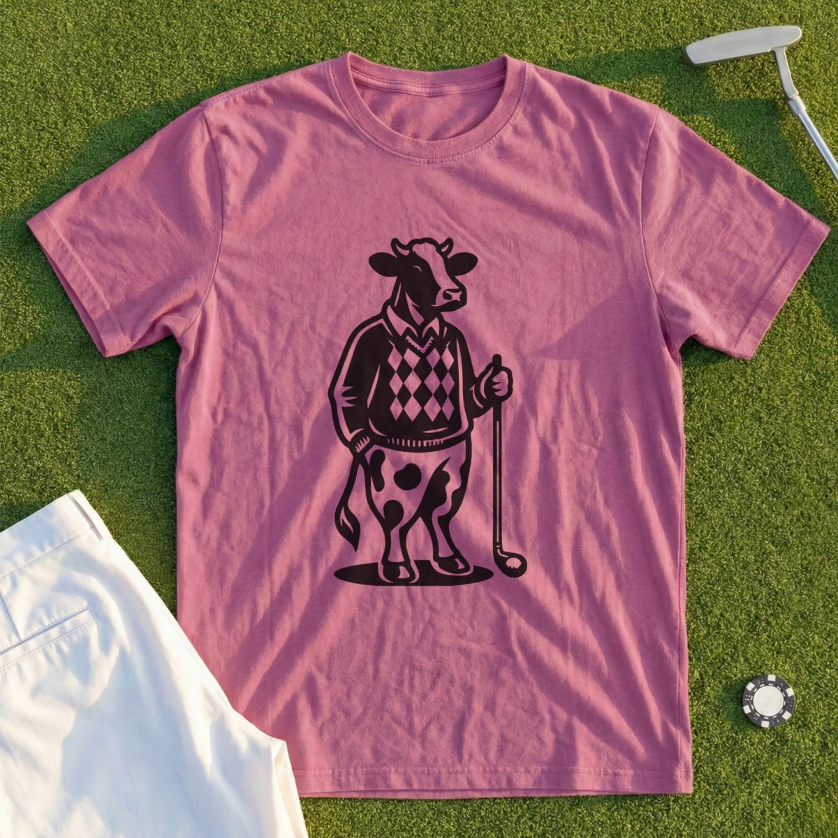 Black and white graphic of a cow in a sweater and kilt holding a golf club.
